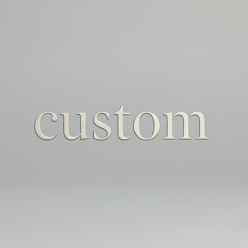 Ceramic bowl with a speckled purple and brown design on a stone surface.