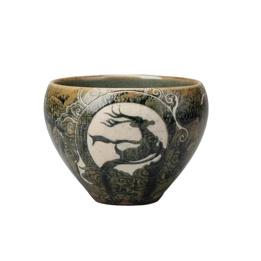 Porcelain Carving Tea Cup Hand holding a decorative ceramic