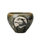 Porcelain Carving Tea Cup Hand holding a decorative ceramic